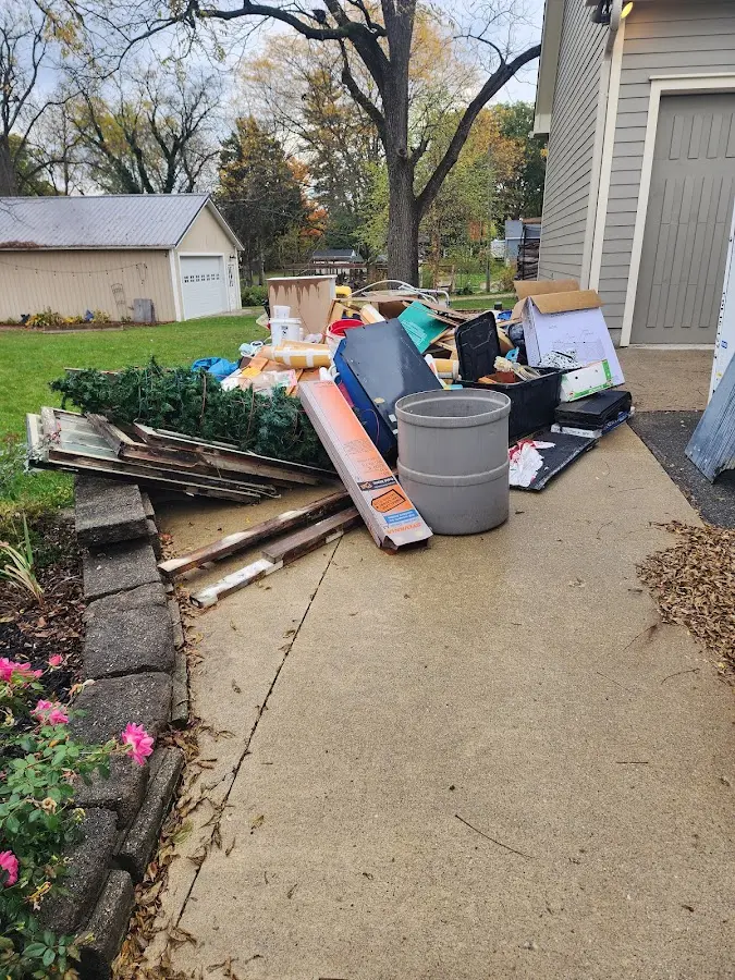 Dumpster being loaded with debris for 30 Yard Dumpster Rental in Champlin